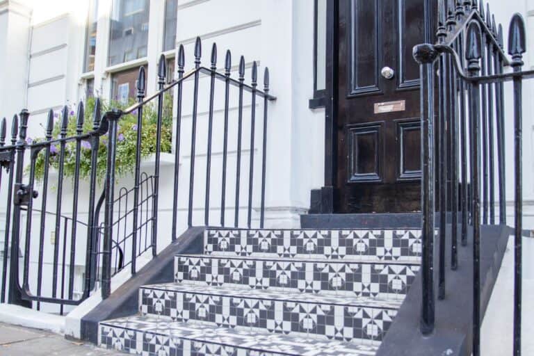 Black and white tiles on the stairs of a British house