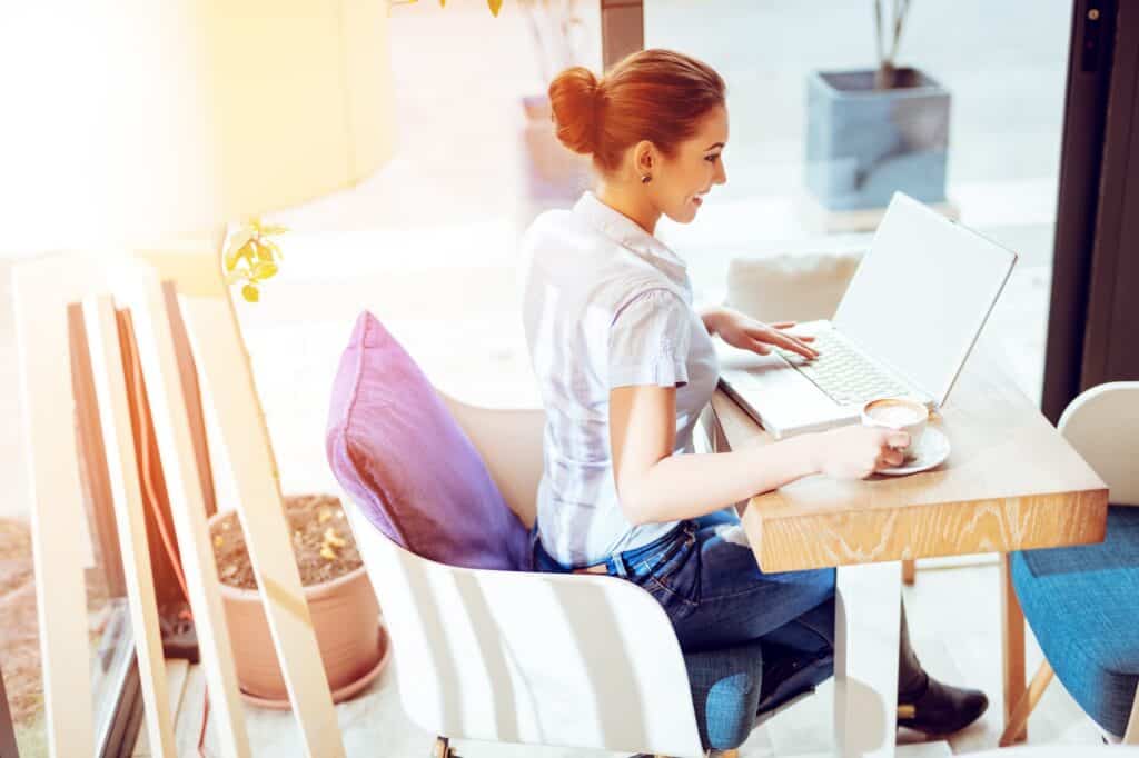 A lady is working in a cafe